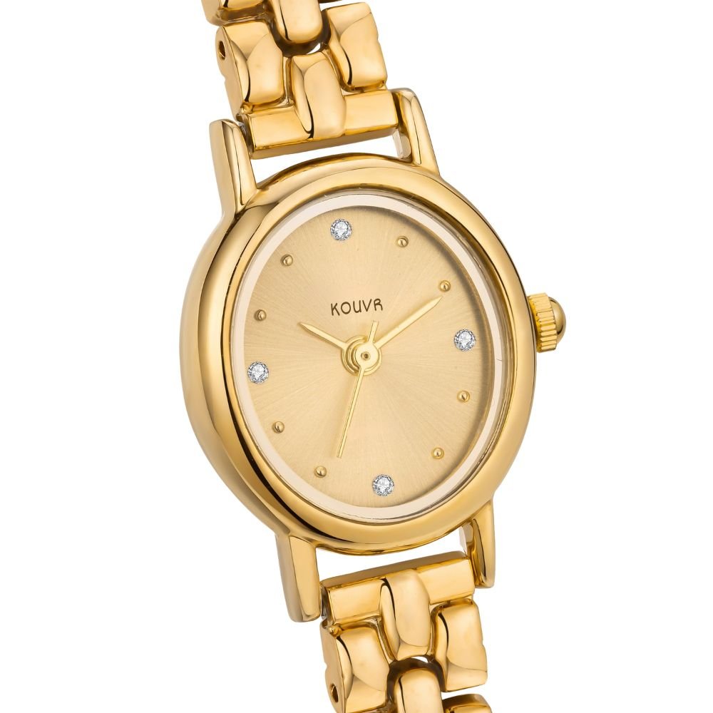 Gold kouvr watch with diamond accents on a white background