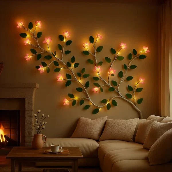 Decorative wall light shaped like a tree branch with lights in a cozy living room.