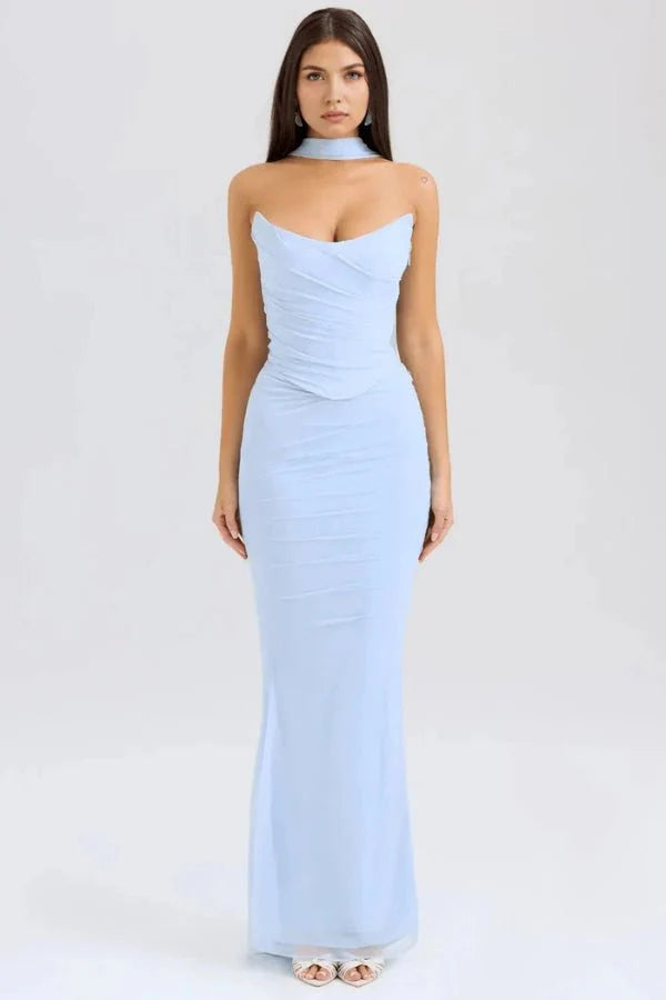 Model wears the Hailey light blue corset prom dress, featuring a draped strapless bodice, ruched mesh maxi skirt, and a choker neck detail, shown from the front.