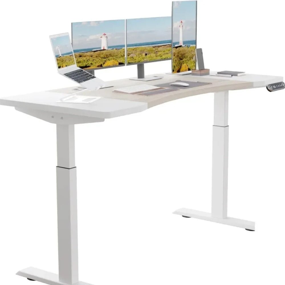 White Kouvr L-shaped desk with multiple computer monitors on a white background