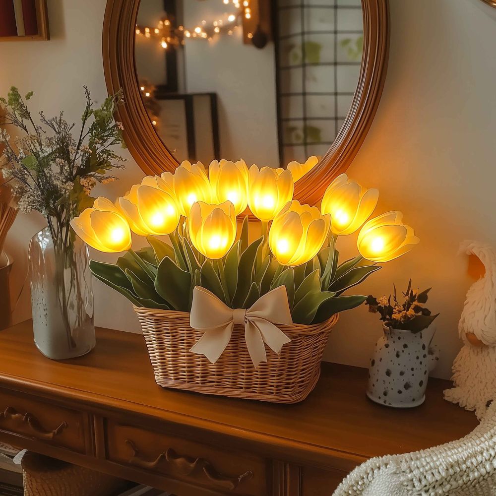 Kouvr Petal Dreams Basket with 12 glowing yellow tulips in a wicker basket on a wooden console table