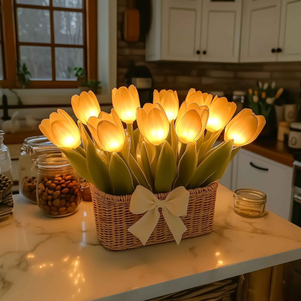 Kouvr Petal Dreams Basket with 12 glowing yellow tulips in a wicker basket on a wooden console table