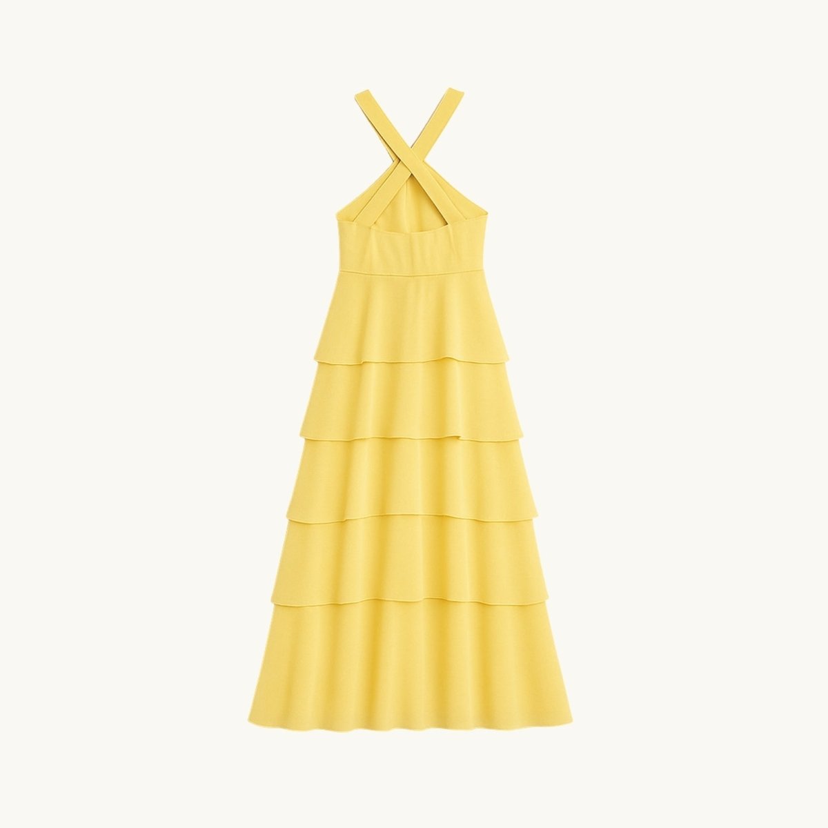 Yellow Kouvr tiered dress on a white background