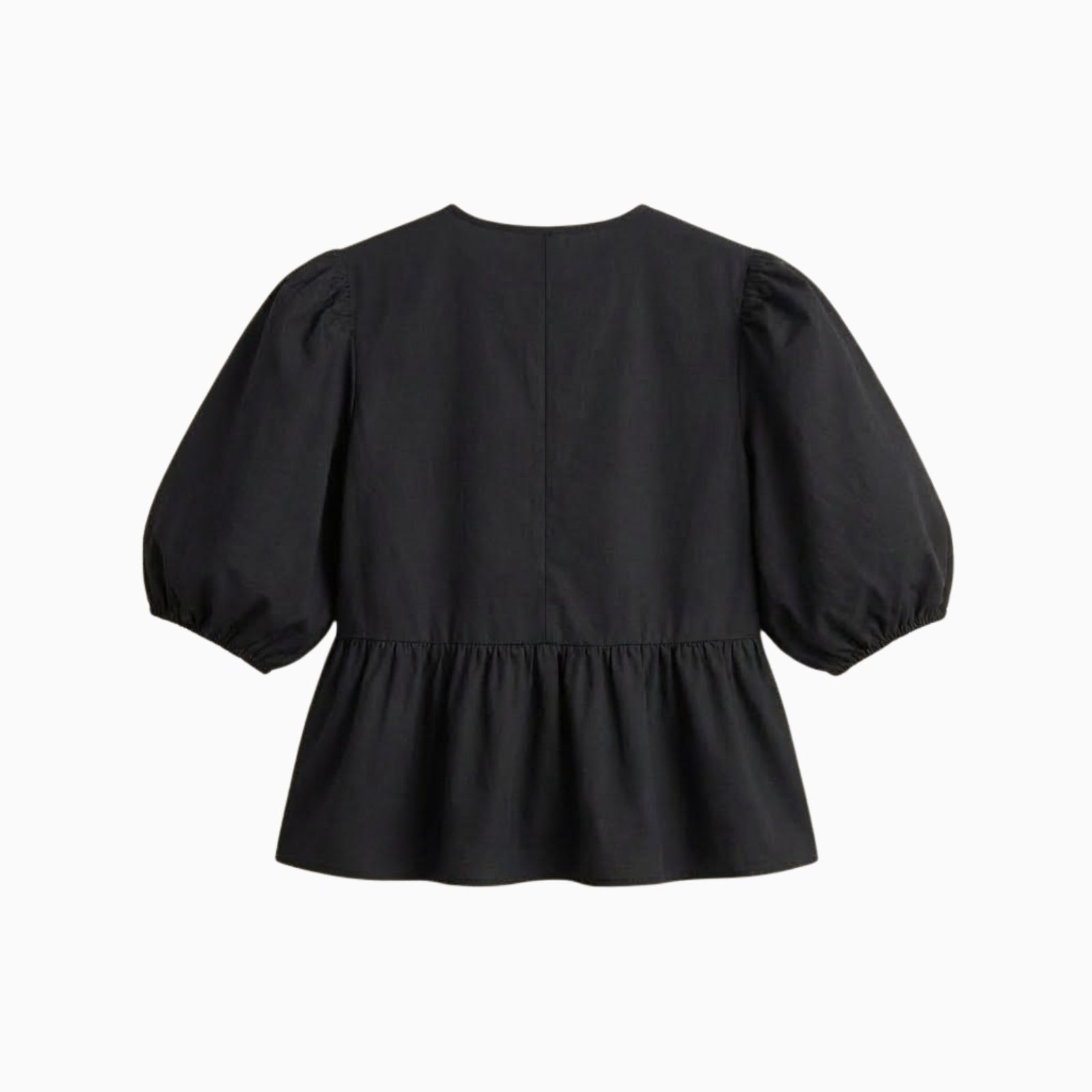 Flat lay showing the back of a black peplum blouse with short puff sleeves, highlighting the clean design.