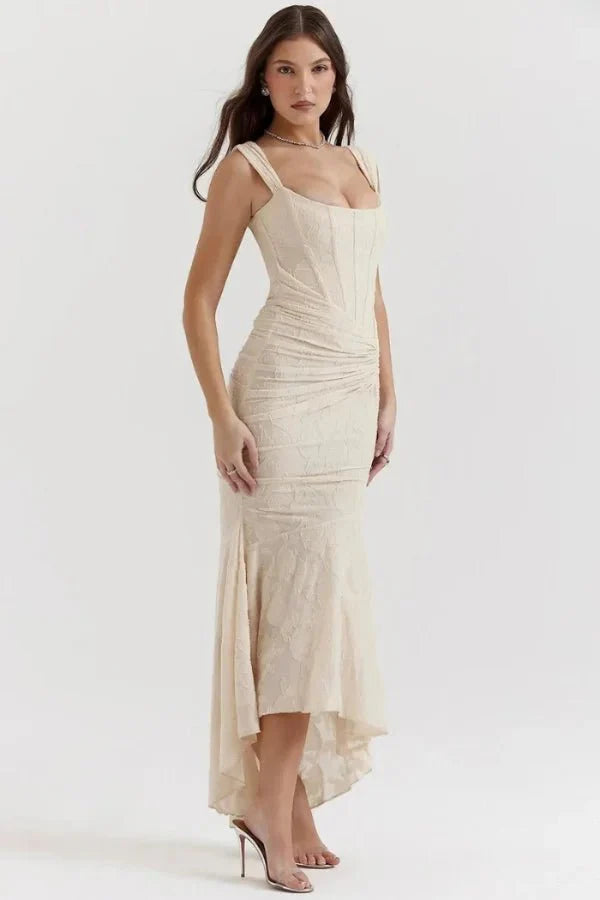 Model wearing the Kouvr Arabella ivory corset midi dress with asymmetrical hem
