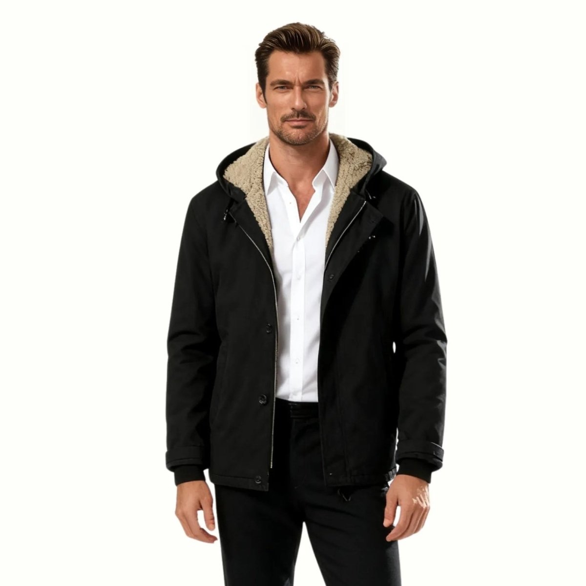 Man wearing the Kouvr Ares black sherpa-lined hooded winter jacket over a white collared shirt.
