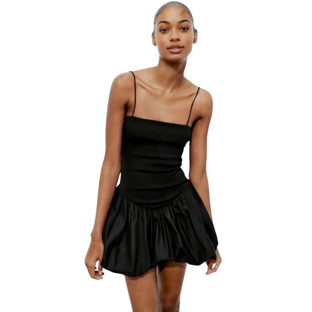 Model wearing the Kouvr Aubrey black mini dress with a voluminous bubble skirt and square neckline