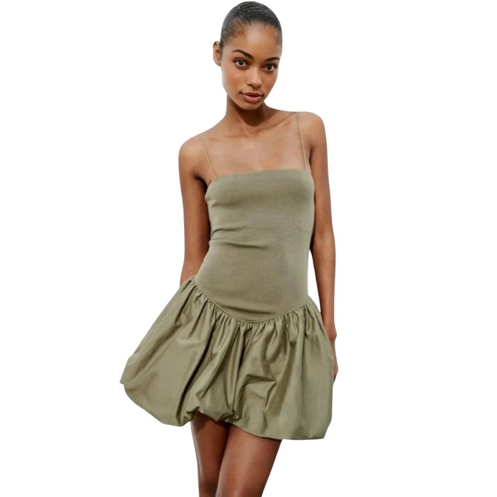 Woman wearing a strapless olive green  kouvr dress on a white background