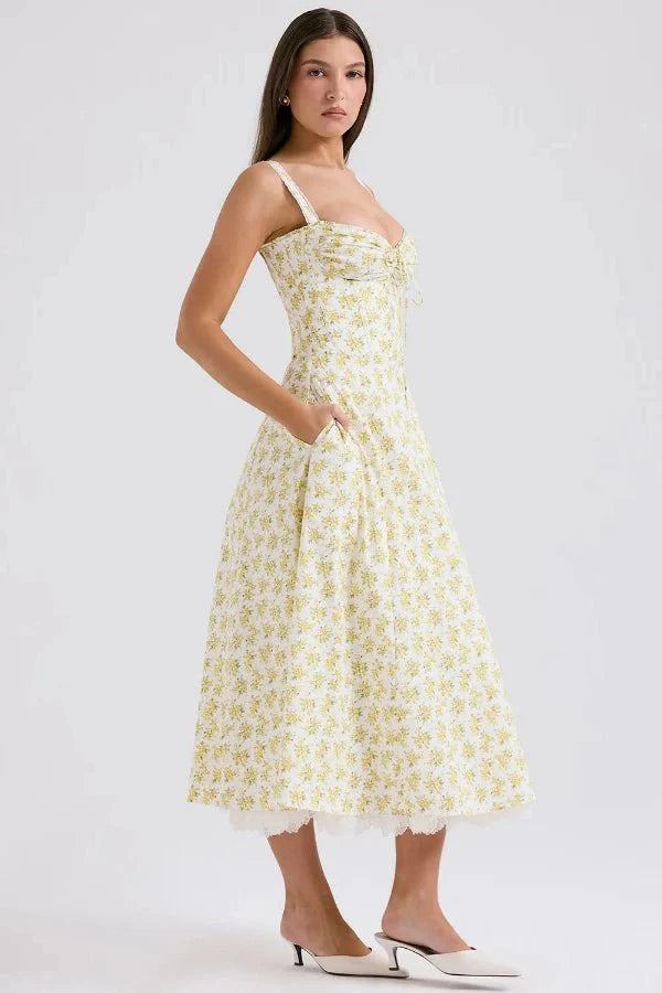 Kouvr's Aviva yellow floral vintage-inspired midi dress with sweetheart neckline and pockets