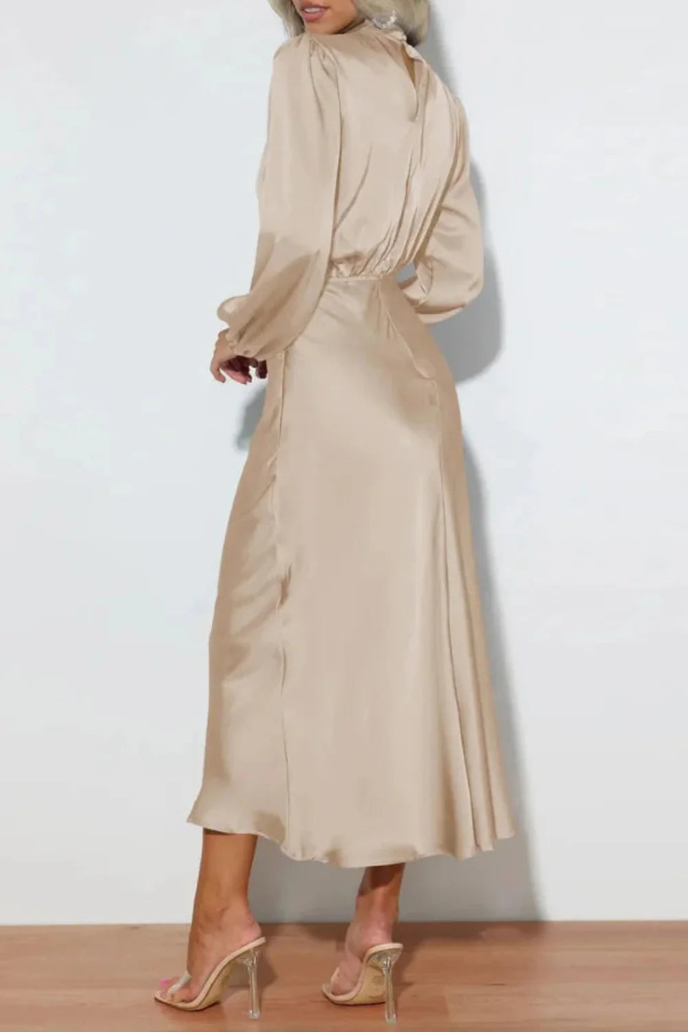 Model wearing Kouvr long sleeve beige satin midi dress with draped cowl neckline