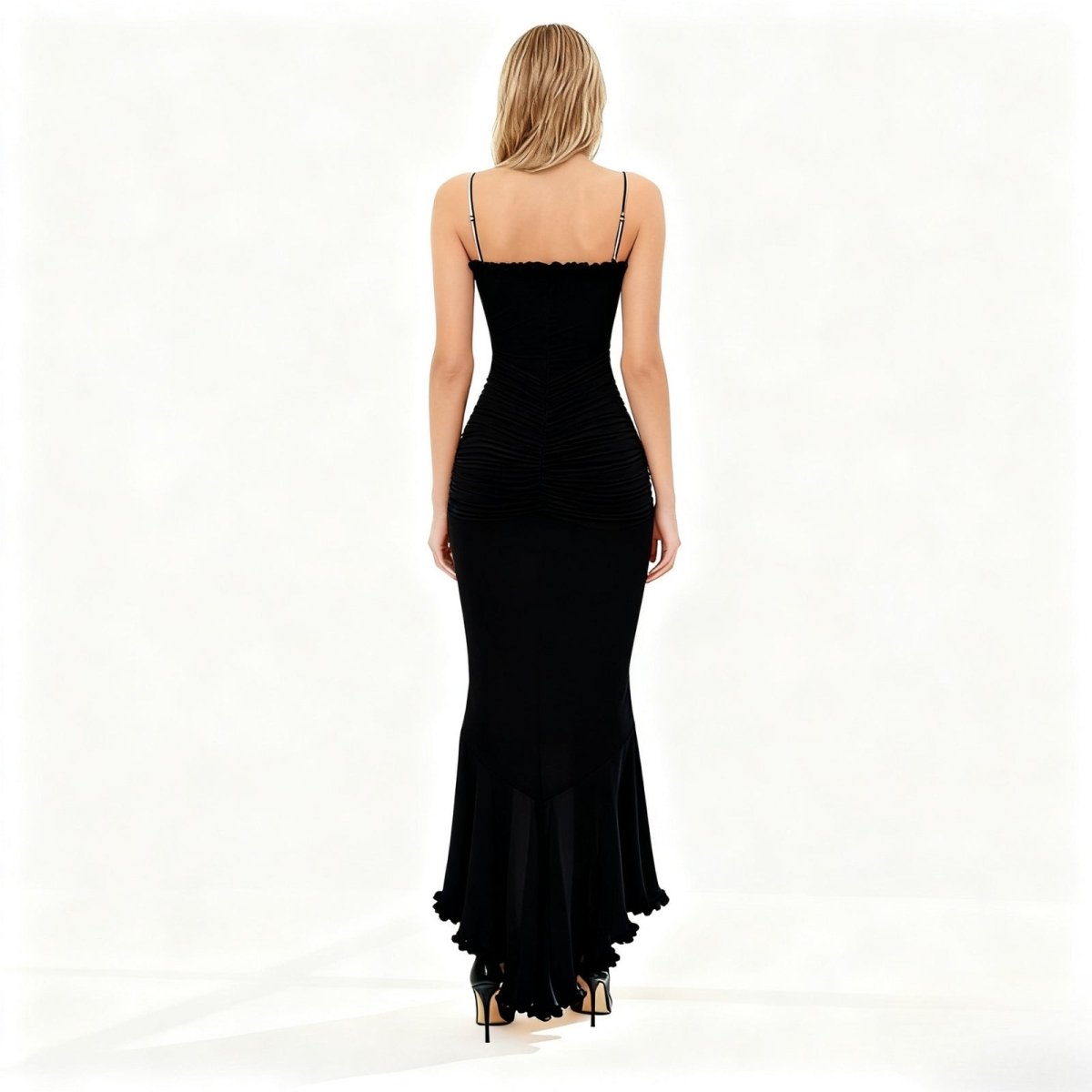 Black evening gown with a fitted bodice and  white background