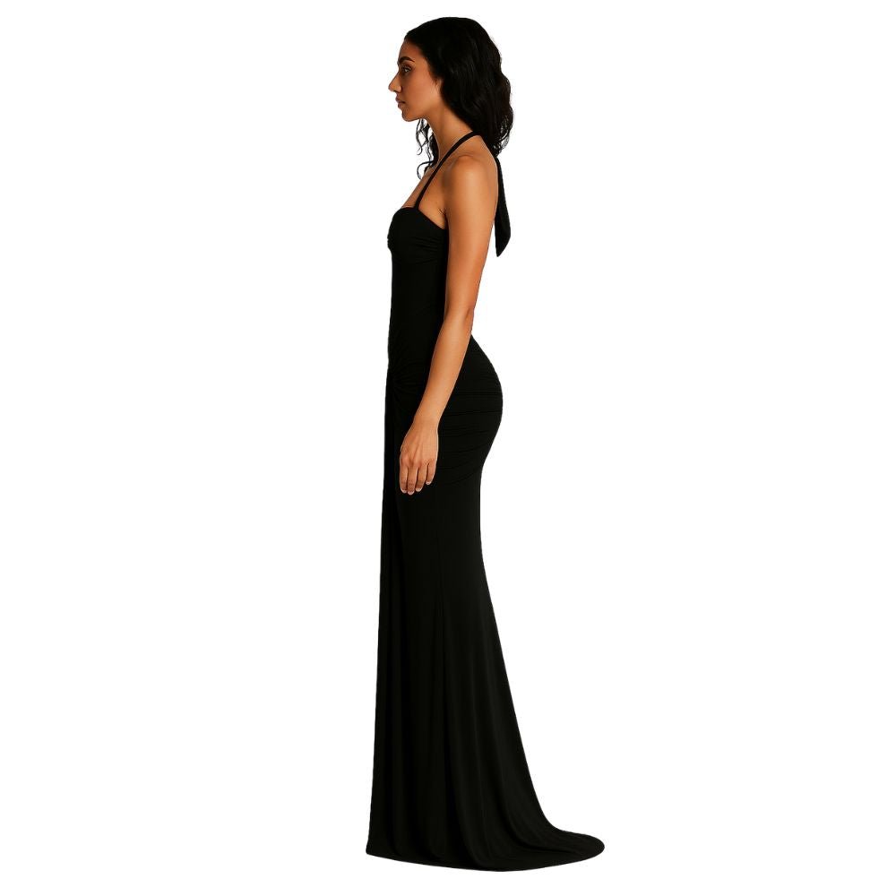 Model from behind in Kouvr black halter neck evening gown with ruching detail