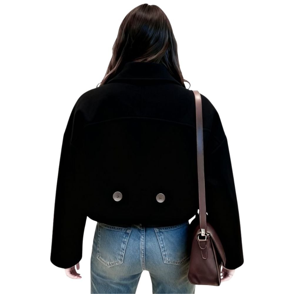 Model from the back wearing the Kouvr Black Niana Cropped Peacoat showing the boxy fit and back button details