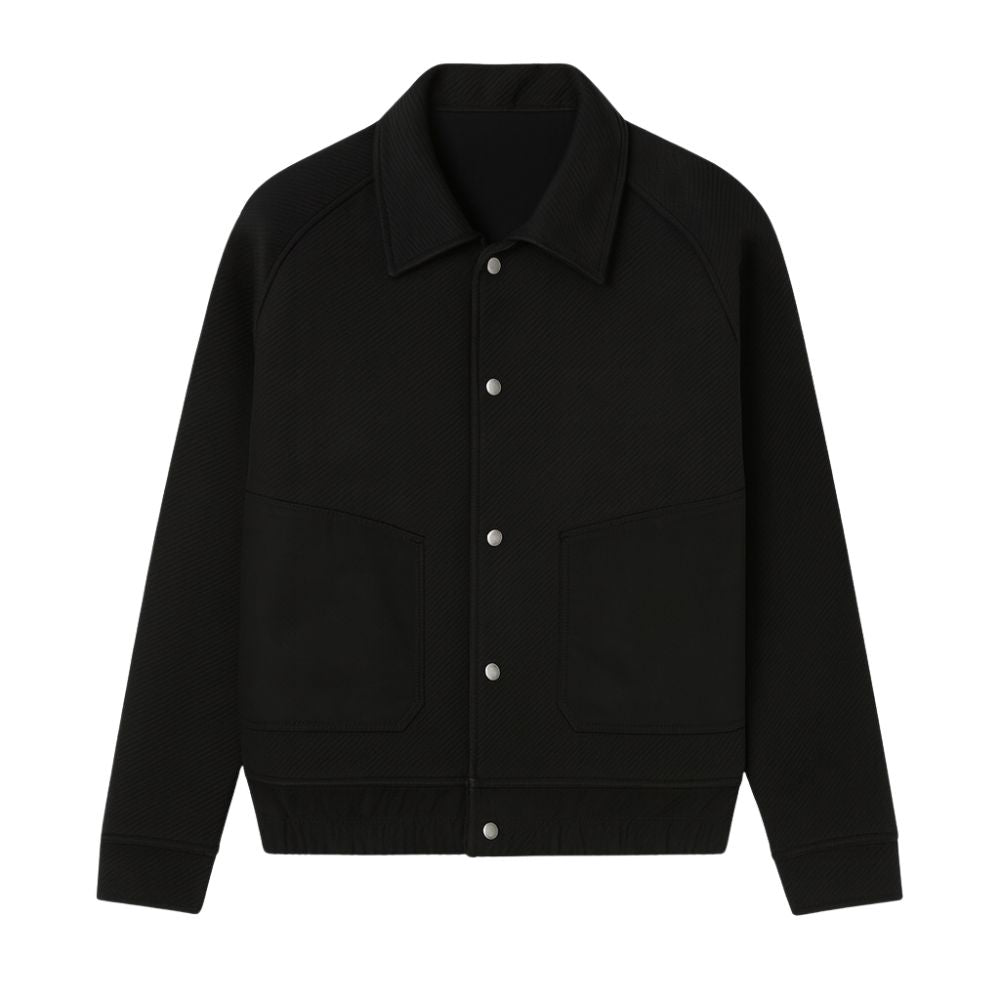 Black kouvr jacket with white buttons on a white background