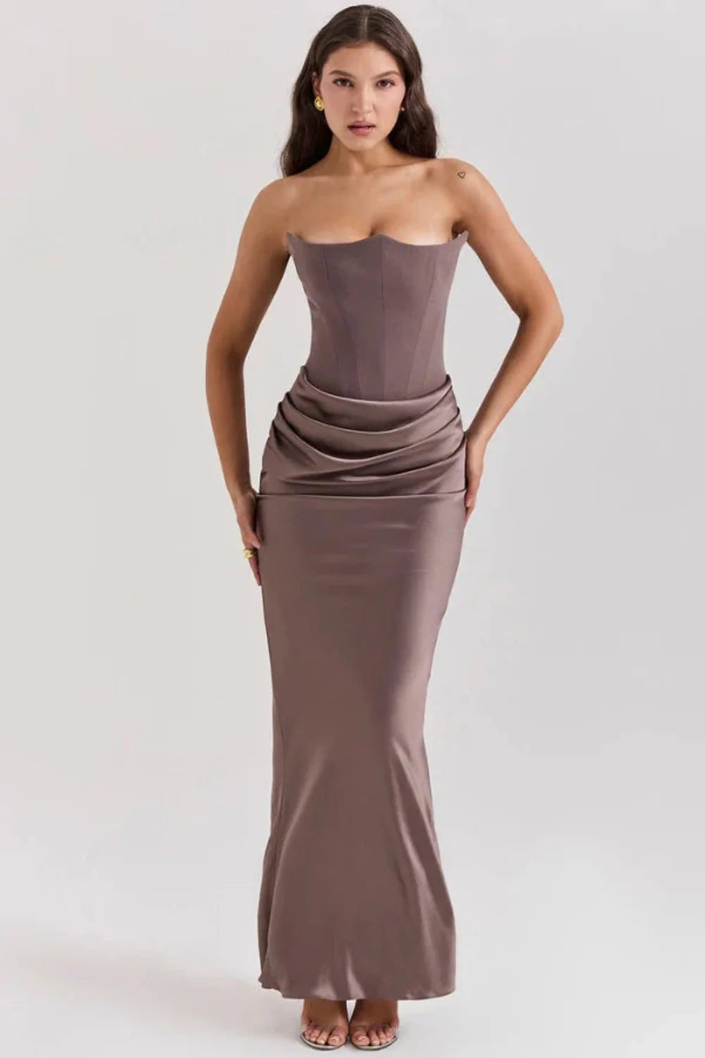 sculptural," "figure-flattering," "boned bodice," "ruched hip detail," and "black-tie attire