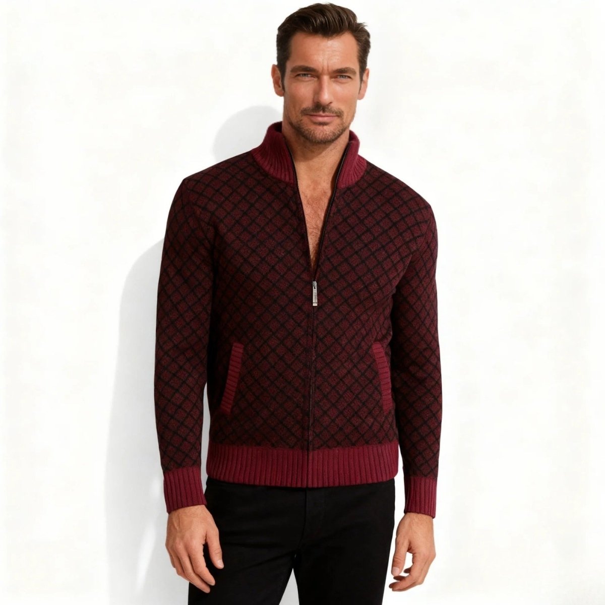 Model wearing the Kouvr Asti men's burgundy and black diamond pattern zip-up cardigan sweater, front view.