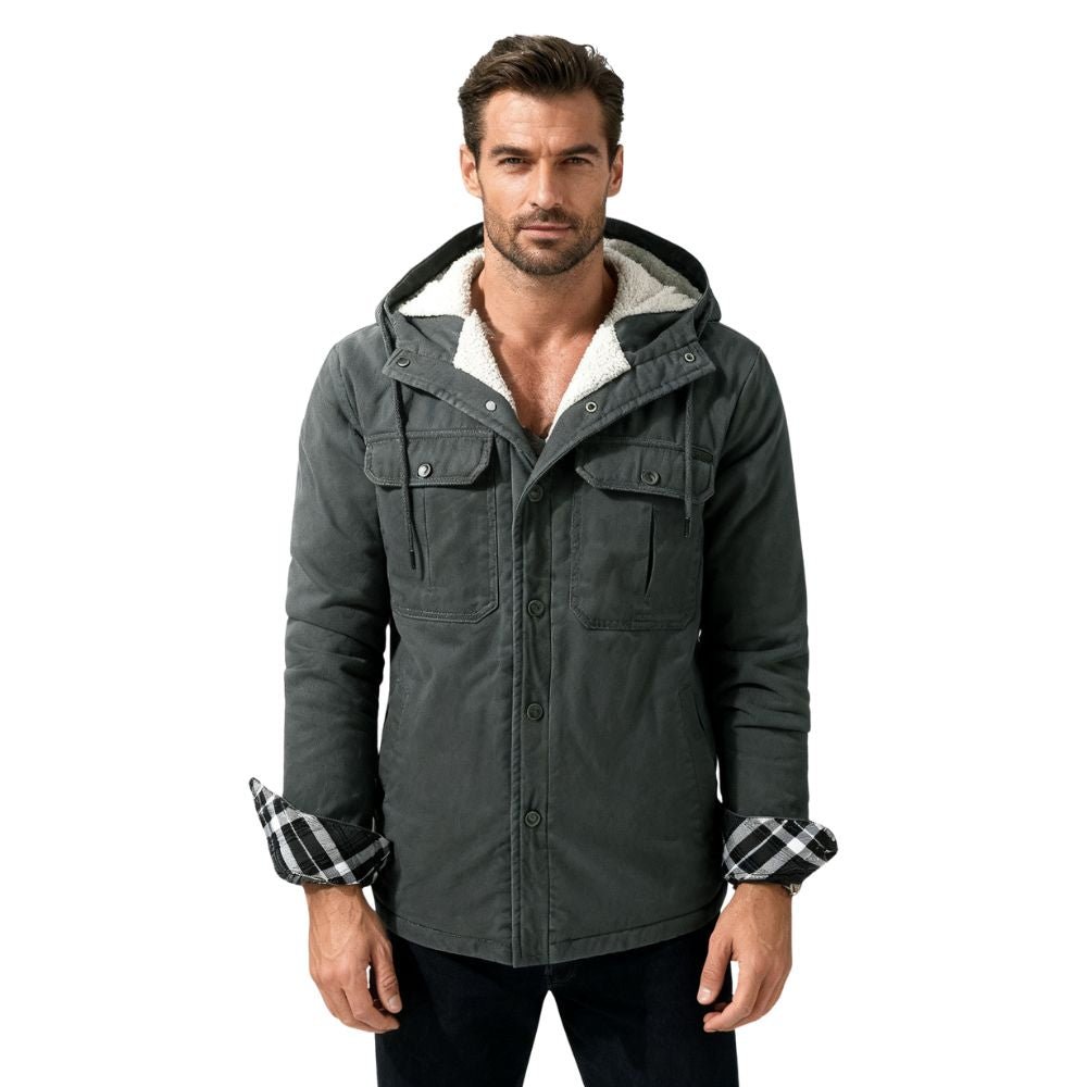 Man wearing a grey kouvr jacket with plaid cuffs on a white background