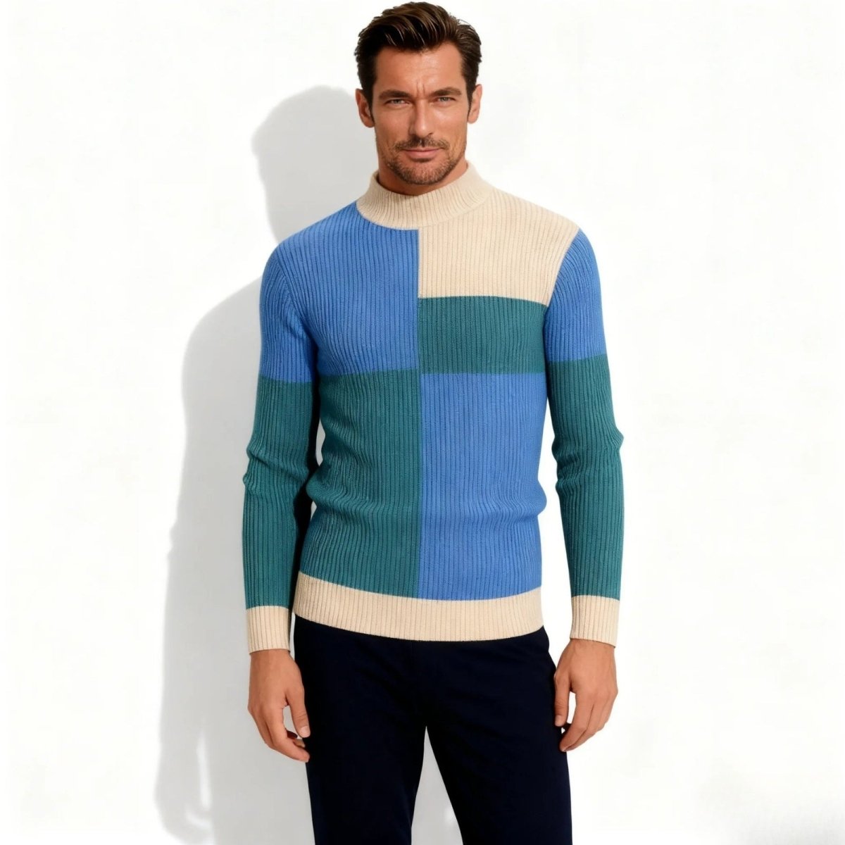 Model wearing the Kouvr Nerthus men's luxury color block mock neck sweater in blue, green, and cream, front view.