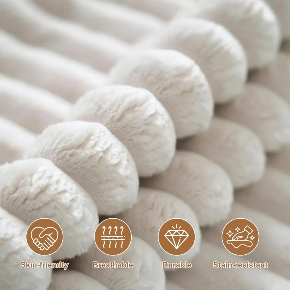 Woman relaxing on the Kouvr corduroy l-shaped cloud sofa in a modern grey living room