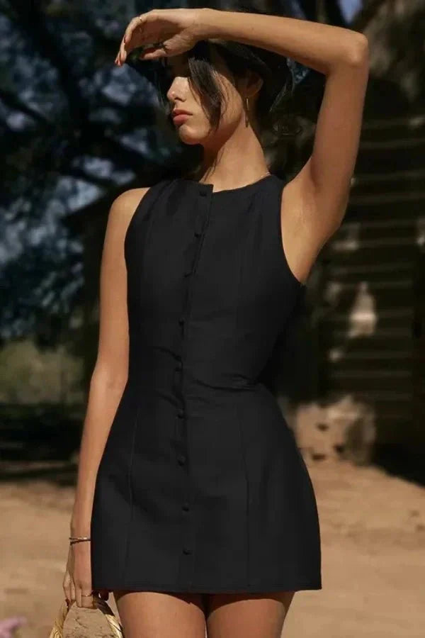 Model wearing the Kouvr Fashion Cosette black sleeveless mini dress