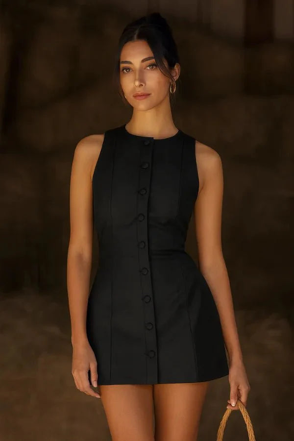 Model wearing the Kouvr Fashion Cosette black sleeveless mini dress