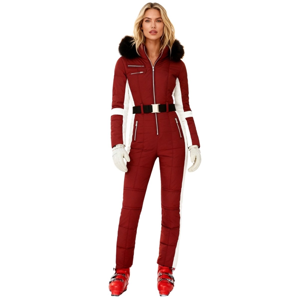 Person wearing a red Kouvr snowsuit with white accents on a white background