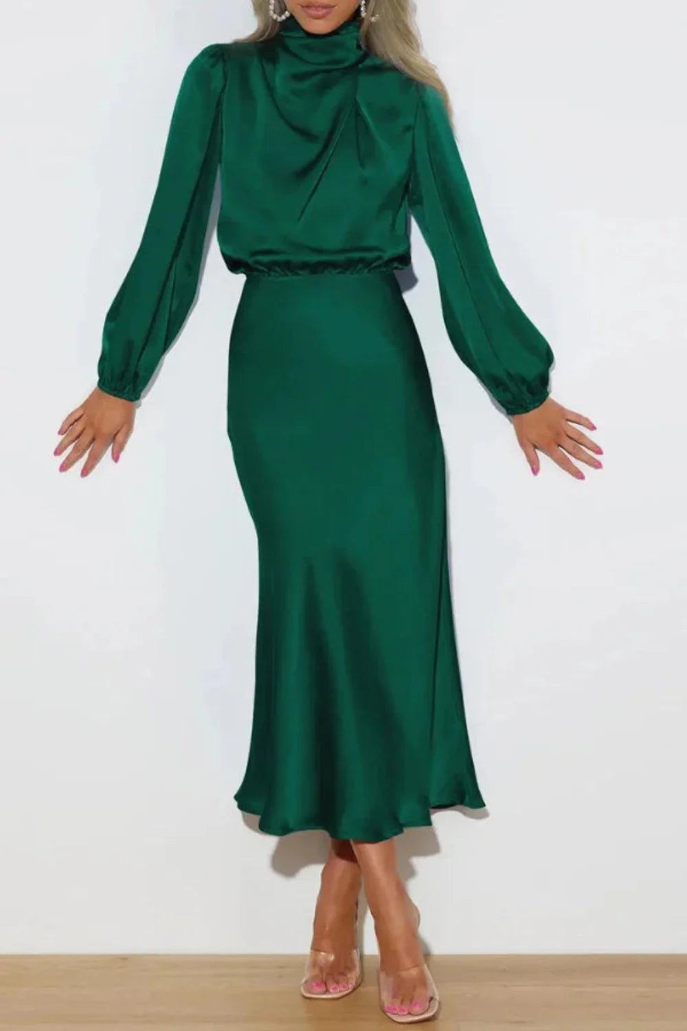 Model from the front wearing the Kouvr Ellana emerald long sleeve satin midi dress