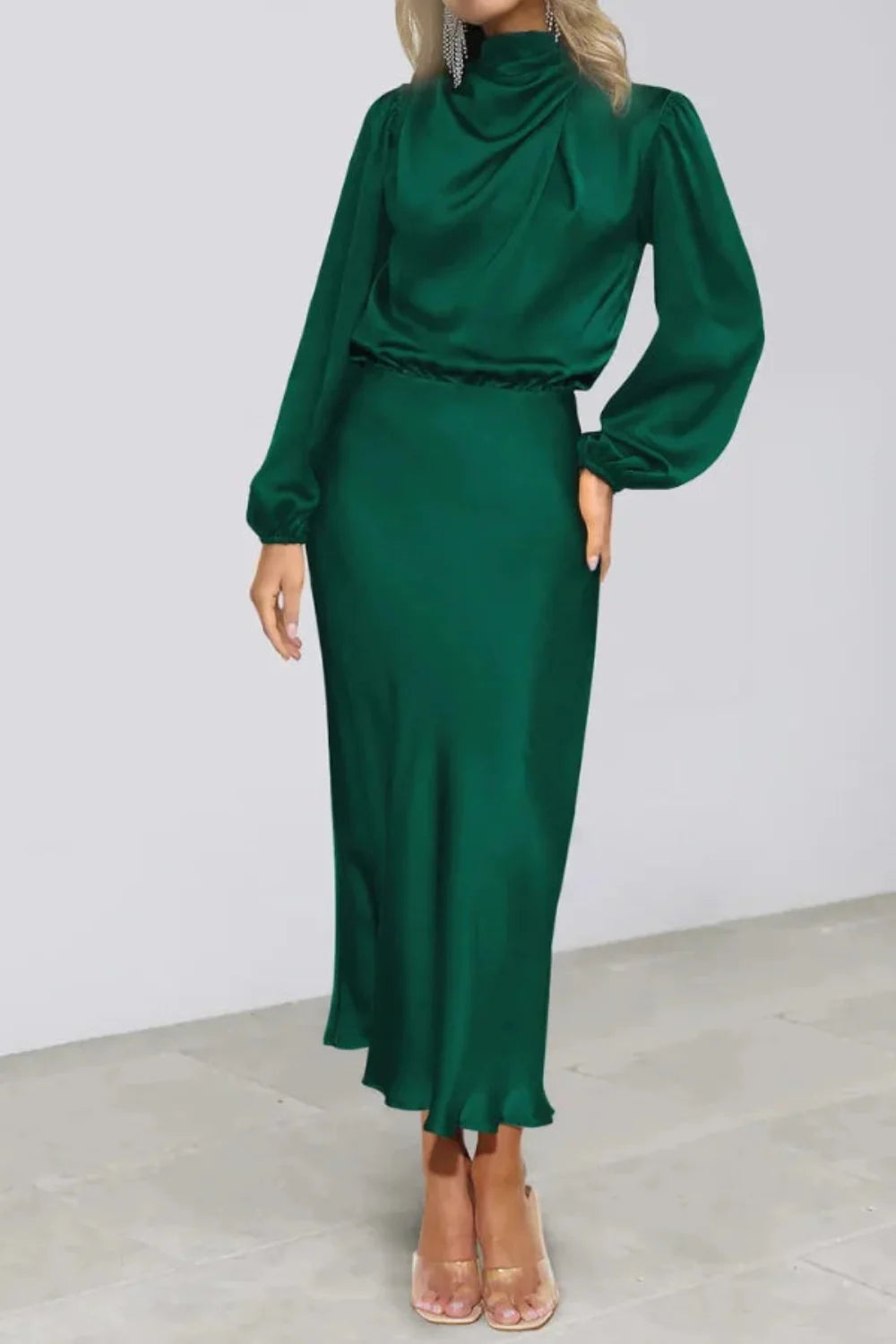 Model from the front wearing the Kouvr Ellana emerald long sleeve satin midi dress