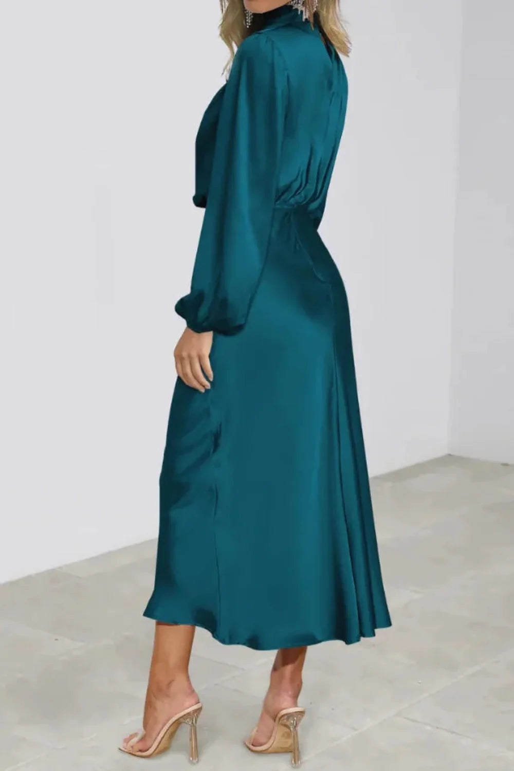 Model wearing the Kouvr Ellana elegant teal satin midi dress with bishop sleeves