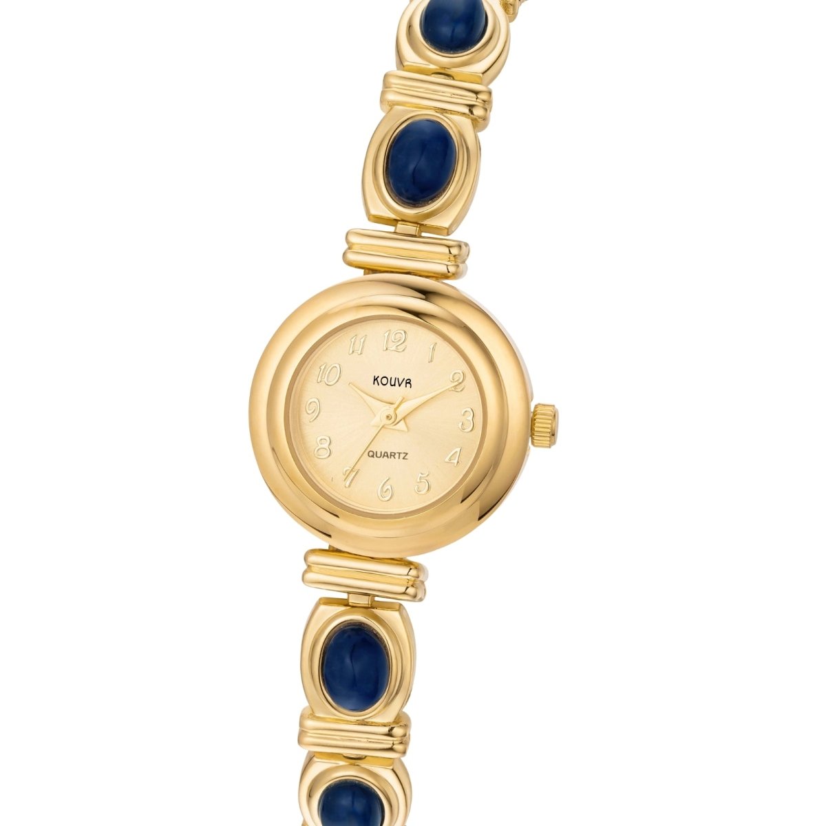 A woman's wrist wearing the Kouvr Elsinora elegant gold and blue stone bracelet watch with a white sleeve.