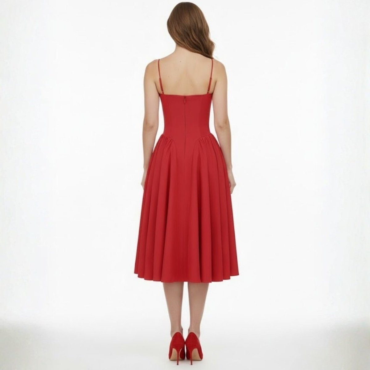 Back view of the Kouvr Evdokia red midi dress showing the thin spaghetti straps and concealed zipper detail.