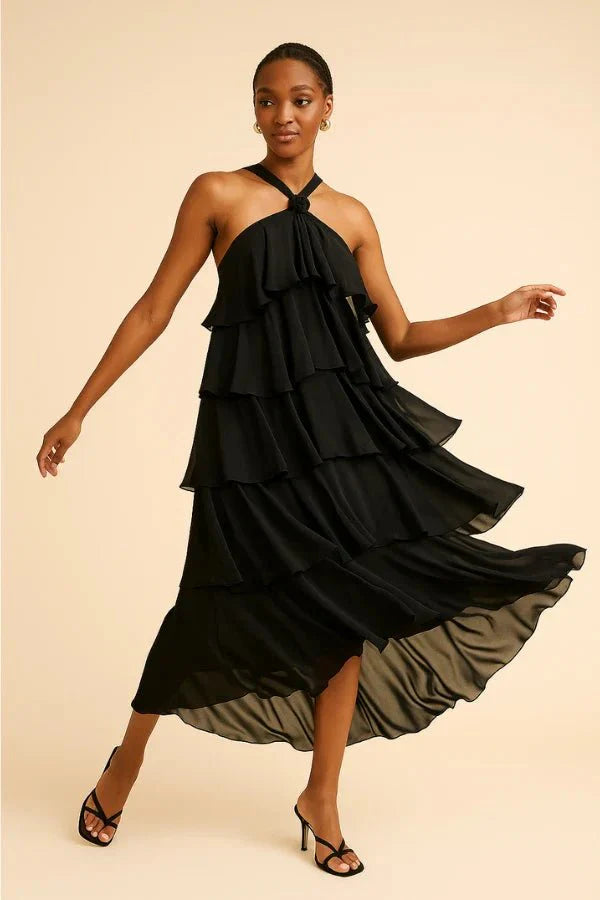 flowy," "cascading," "elegant silhouette," "floor-length," "sophisticated," and "minimalist formalwear