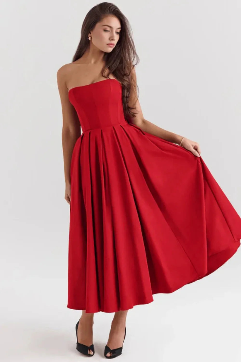 Model wearing the Kouvr Fashion Aneri red strapless formal midi dress