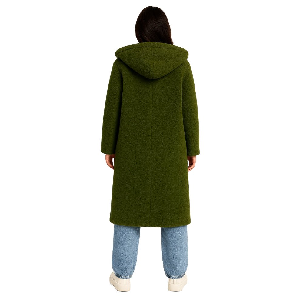 oversized fit," "cocoon silhouette," "cozy outerwear," "investment piece," "sustainable wool," "trans-seasonal jacket