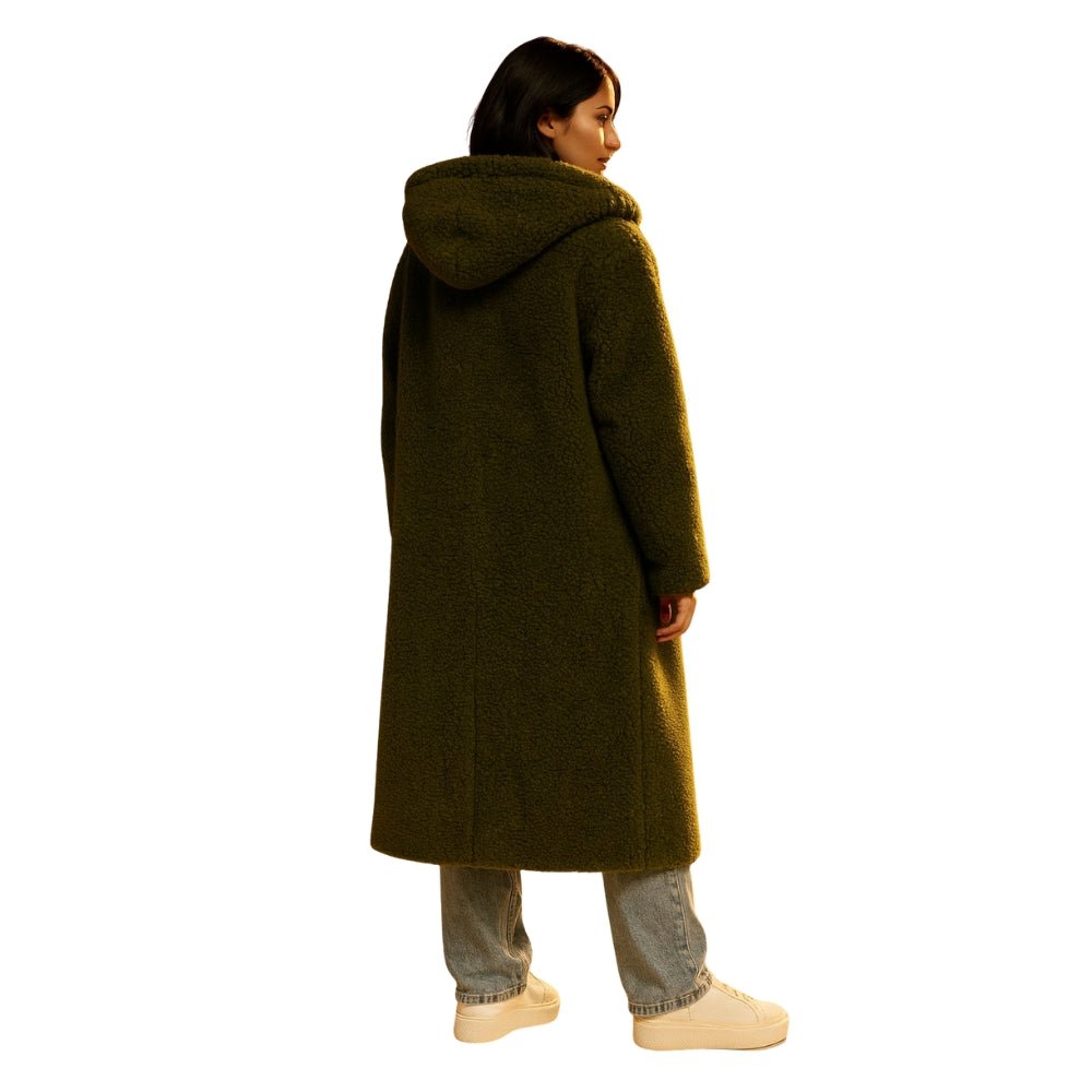 oversized fit," "cocoon silhouette," "cozy outerwear," "investment piece," "sustainable wool," "trans-seasonal jacket