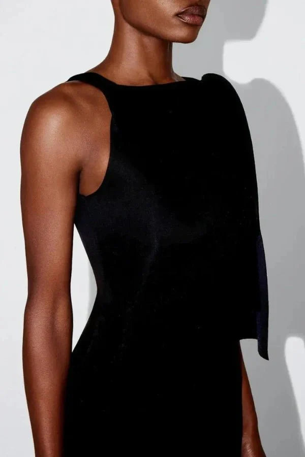 column silhouette," "draped shoulder," "floor-skimming hem," "minimalist aesthetic," "understated elegance