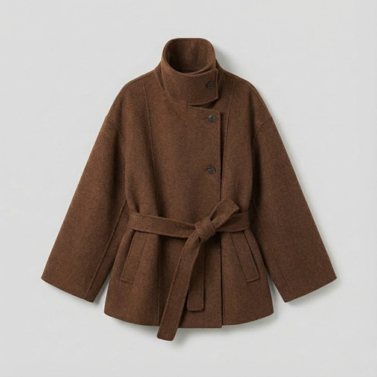 Flat lay of the Kouvr Fashion brown wool wrap coat showing the asymmetrical button closure and tie belt.