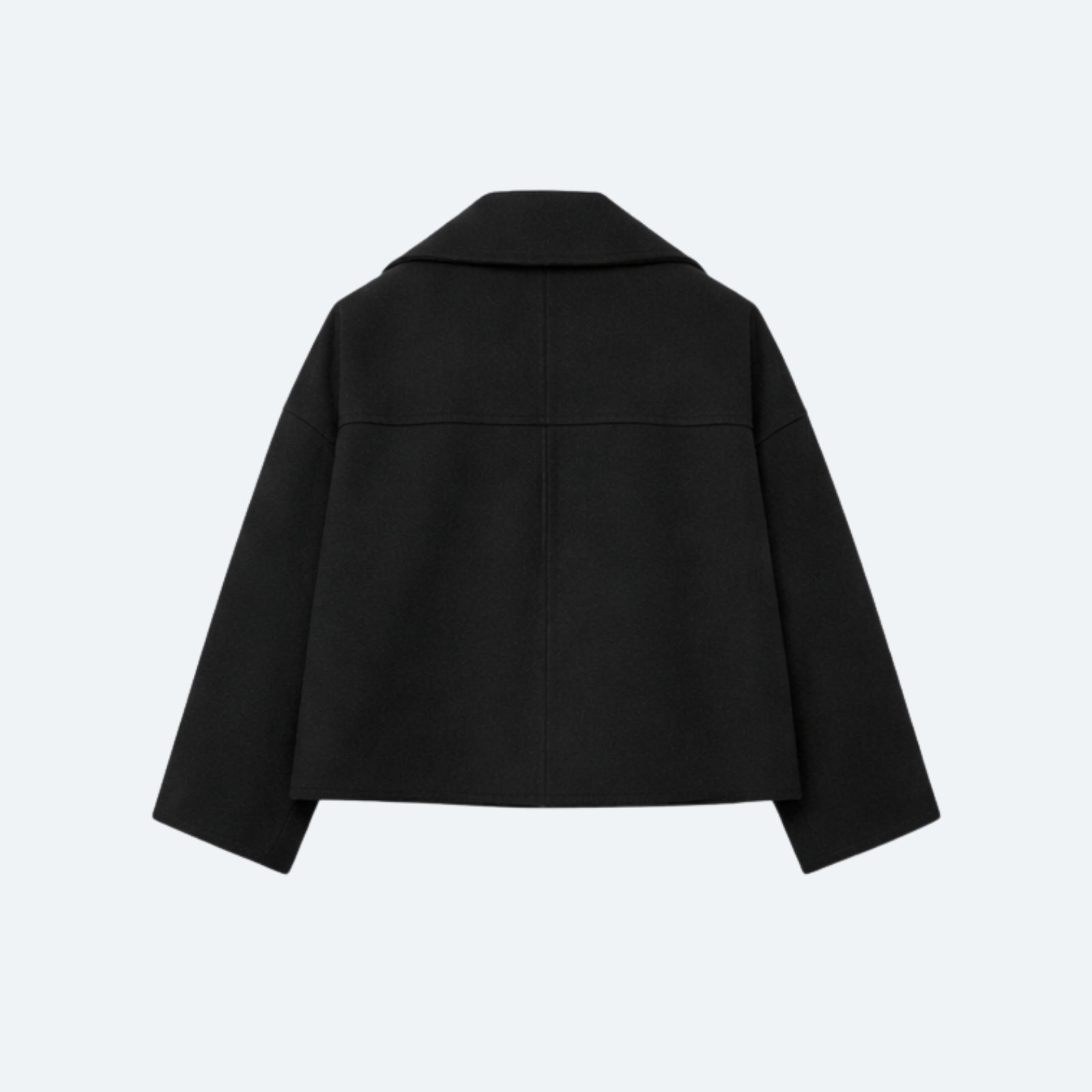 Product-only photo of the back of the black cropped jacket, highlighting the yoke and clean construction.