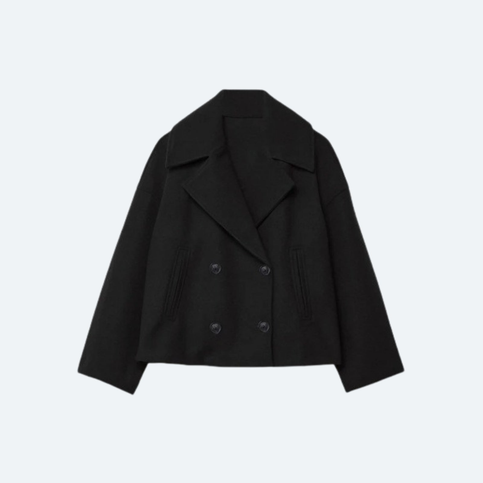 Product-only photo of the black cropped double-breasted wool jacket on a white background, showing the lapels and button placement.
