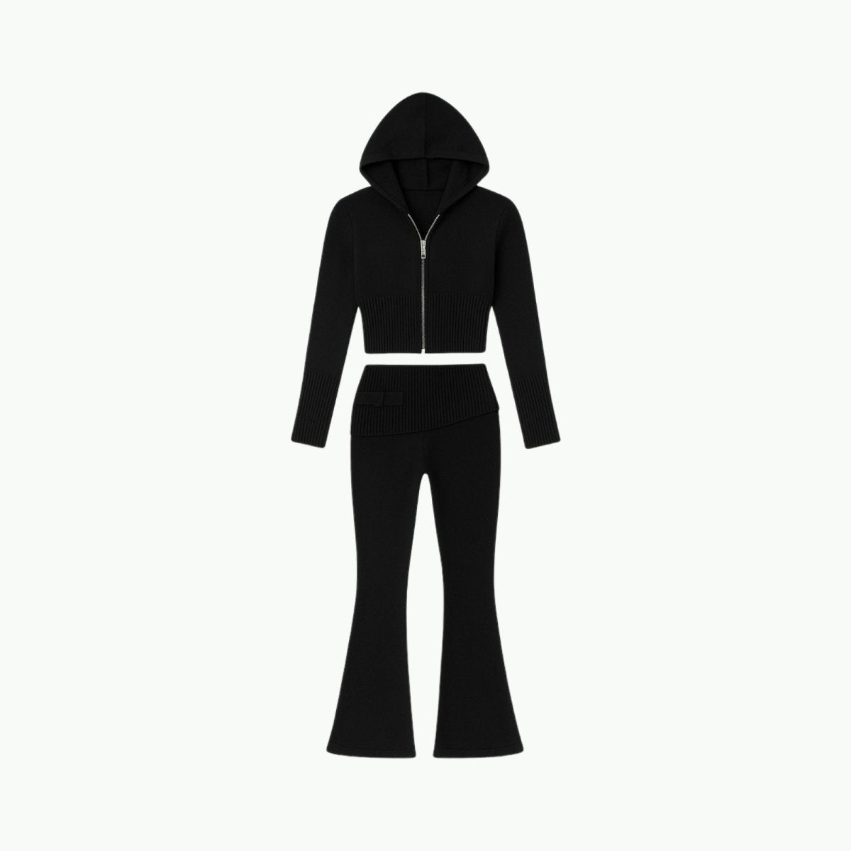 Flat lay of the black knit matching set from Kouvr Fashion, including the cropped zip hoodie and flared pants with asymmetrical waistband detail. 
