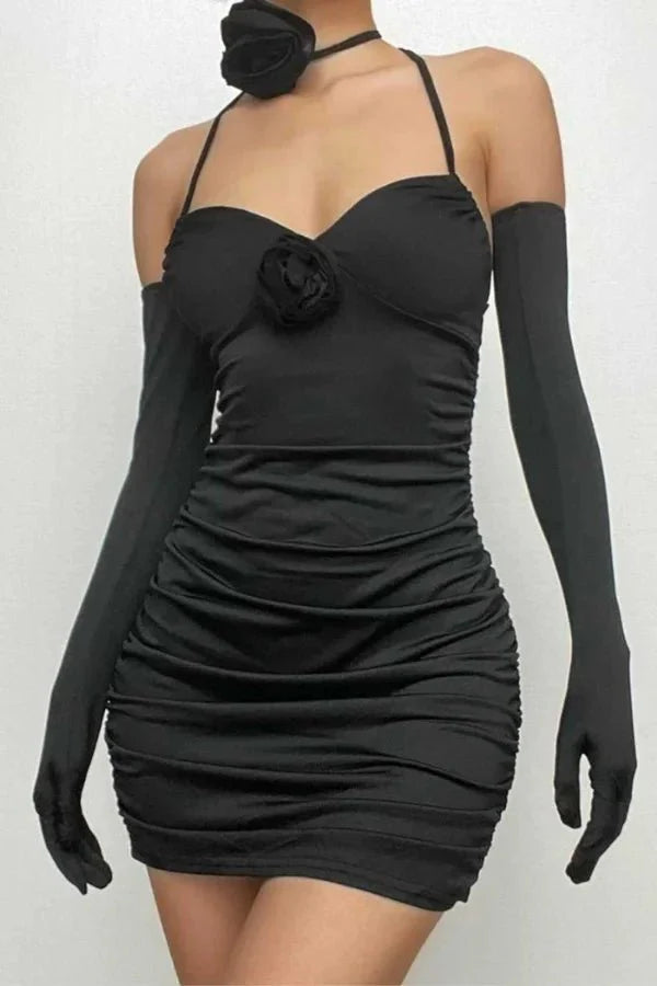 Model wearing Kouvr Fashion Chanti Bloom black ruched mini dress with matching opera gloves and rosette choker