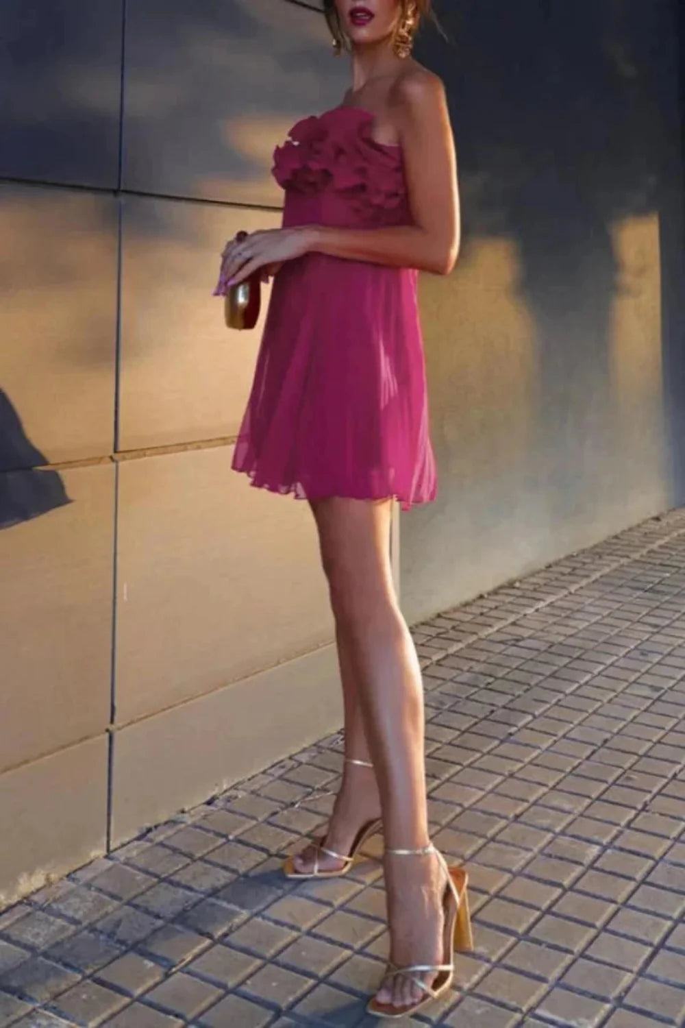 Model wearing the Kouvr Fashion Chitty Pink Ruffle Strapless Mini Dress