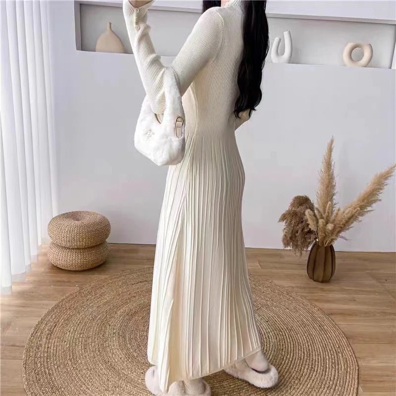 Close-up view of the ribbed knit texture and button cuff details on the ivory Dannah midi dress from Kouvr Fashion.