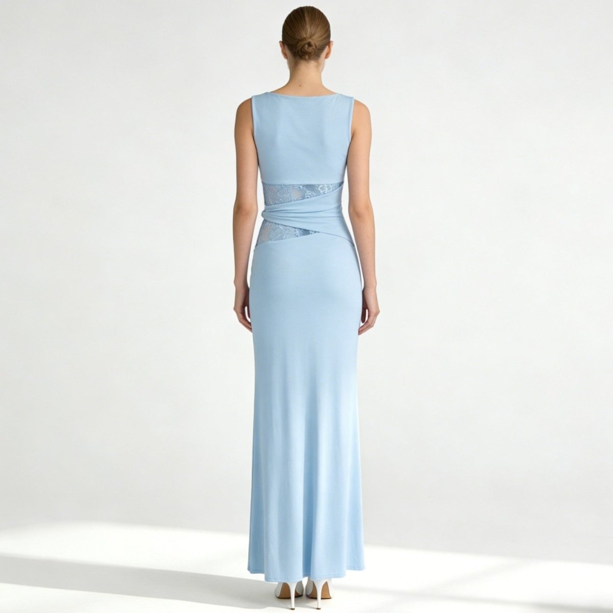 Back view of the Kouvr Fashion Deborah sleeveless evening gown in light blue, showcasing the clean lines and wrapped waist design.