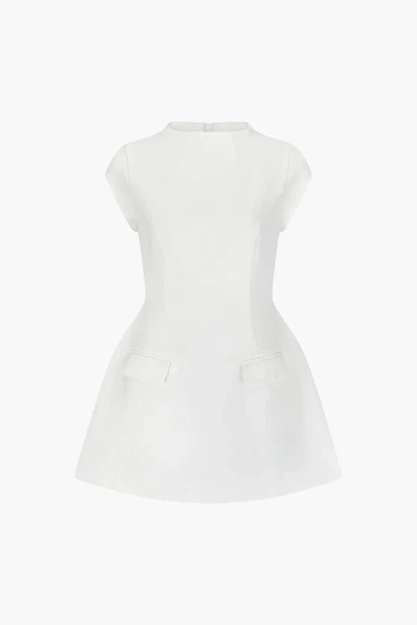Studio product shot of the white Ella A-line mini dress with a mock neck and structured pockets on a white background.