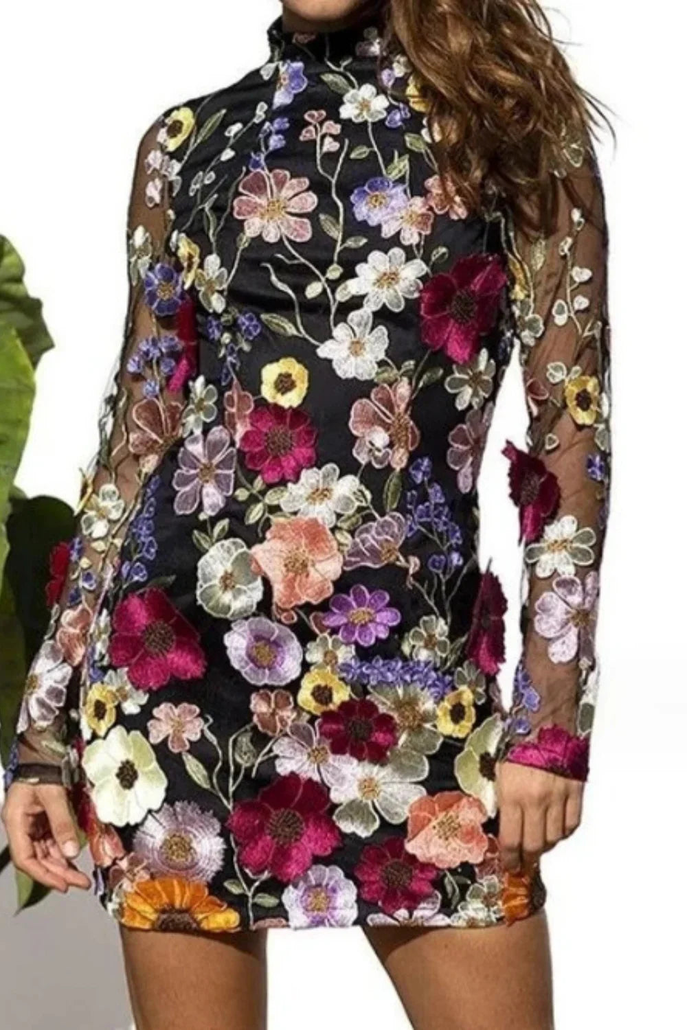 Model in Kouvr Fashion high neck black mini dress with vibrant multicolor 3D floral appliqué embroidery