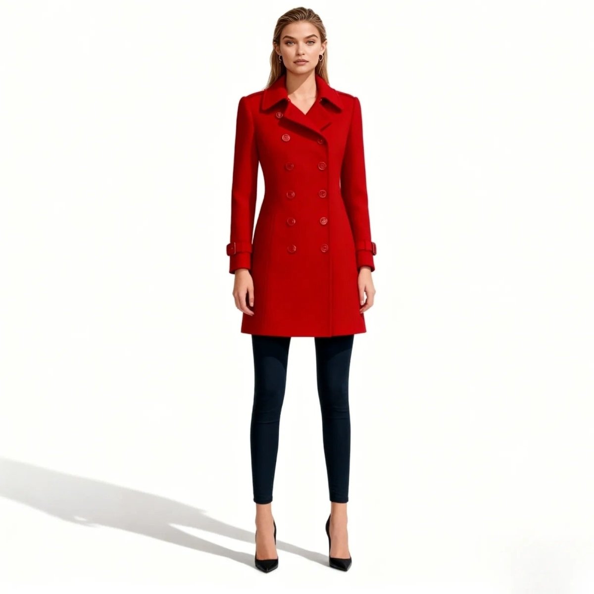 Woman wearing a red Kouvr coat on a white background