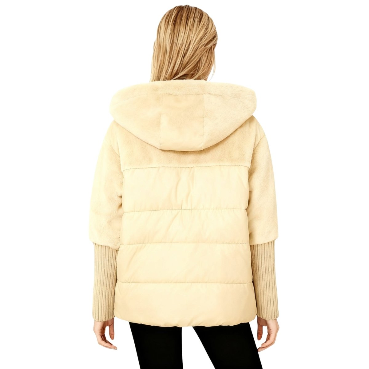 Beige kouvr puffer jacket worn by a person on a white background