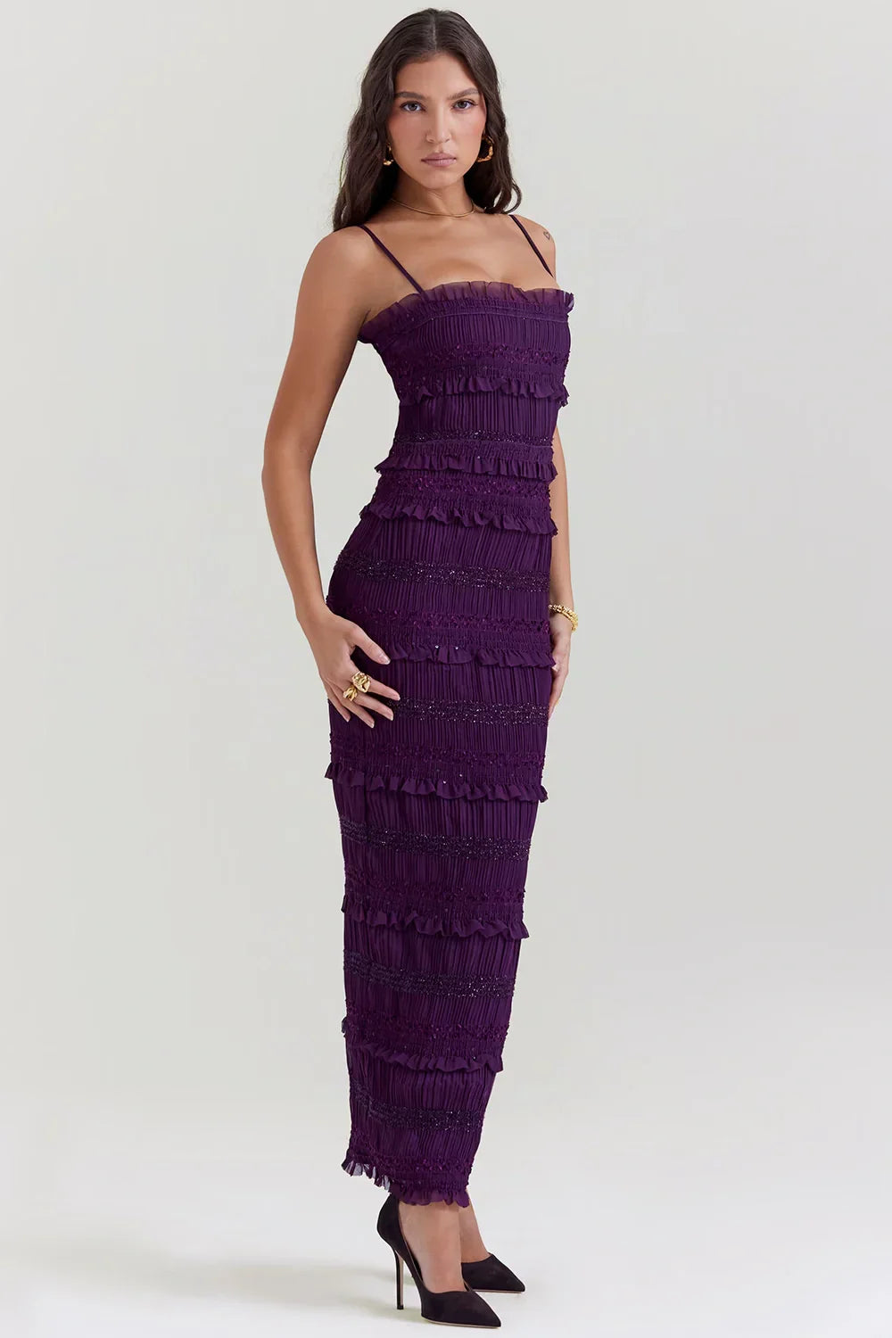 Model wearing the Kouvr Fashion Hannie formal evening jumpsuit in plum purple with tiered ruffles and bead embellishments