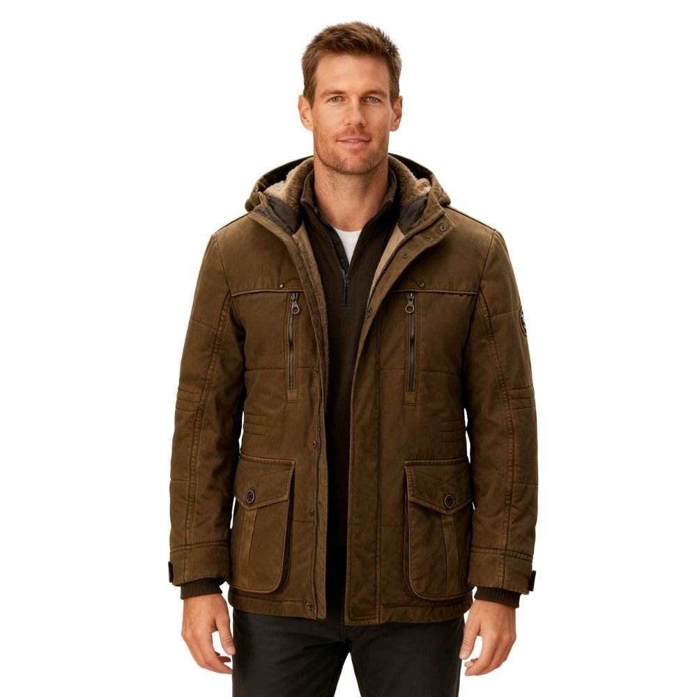 Man wearing a brown kouvr jacket with a hood on a white background